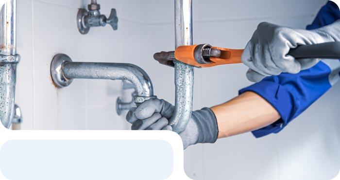 plumber fixing kitchen sink